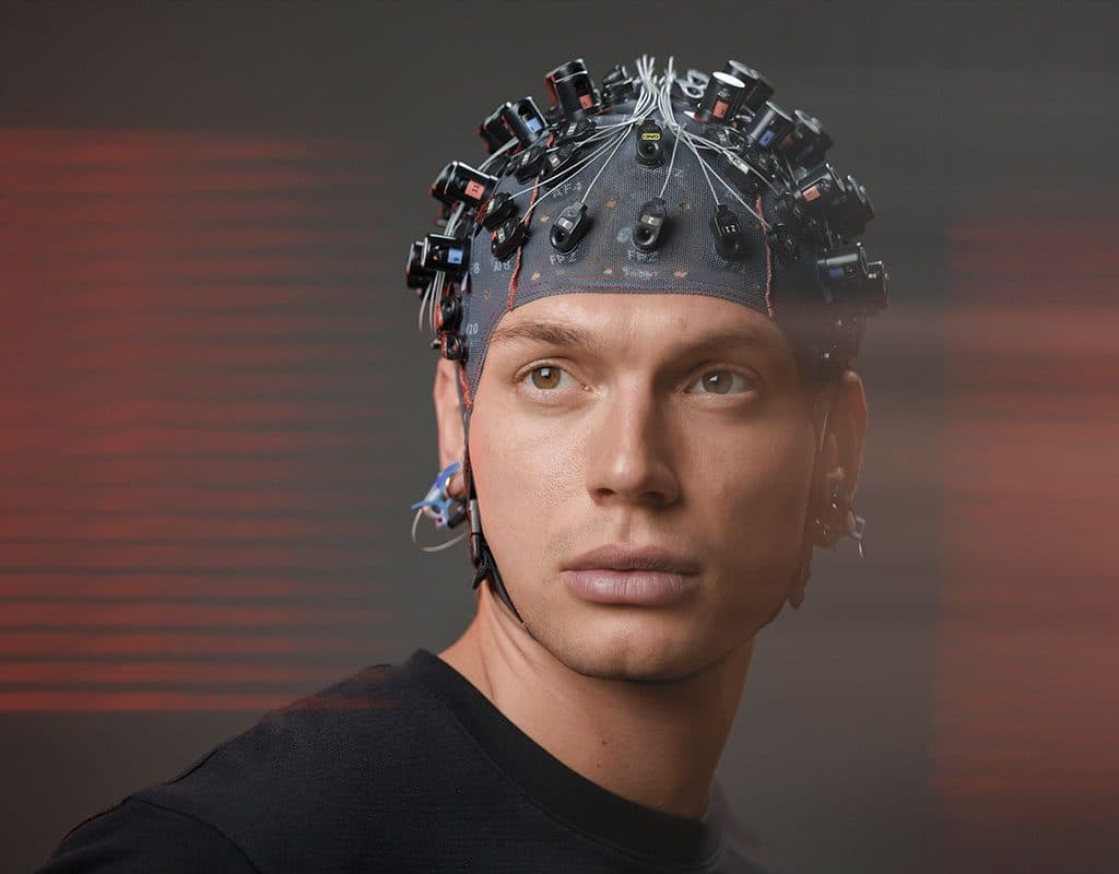 A participant wearing an EEG and fNIRS cap