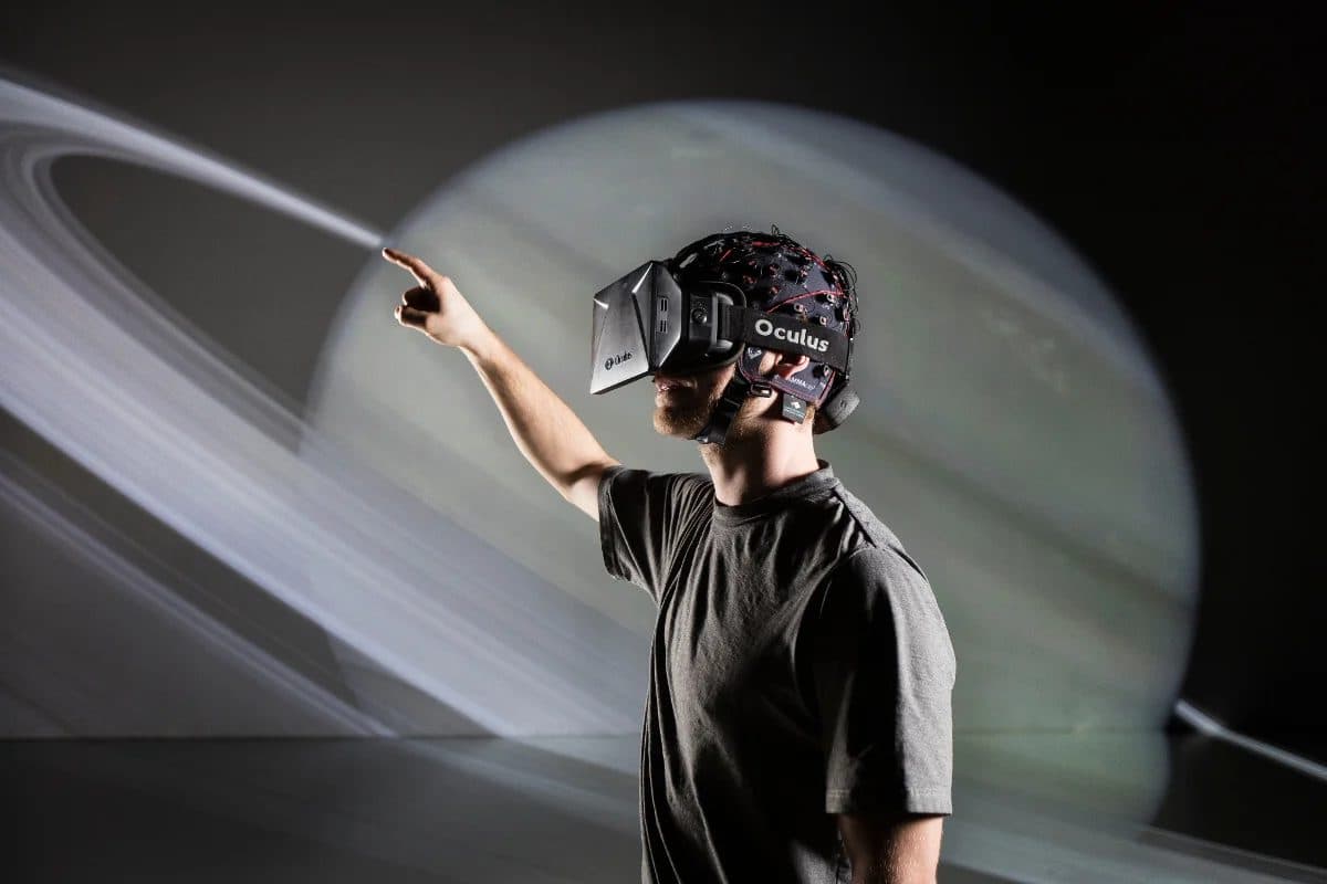 A participant with a VR headset and an EEG cap