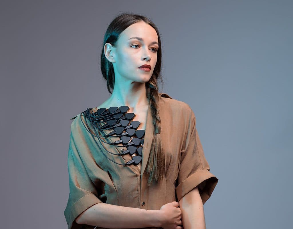 A woman with g.Pangolin grids and headstages on her chest