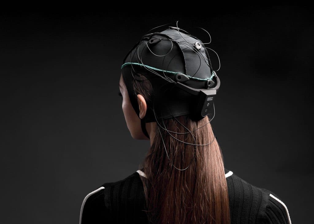 A woman wearing Unicorn Hybrid Black, from behind